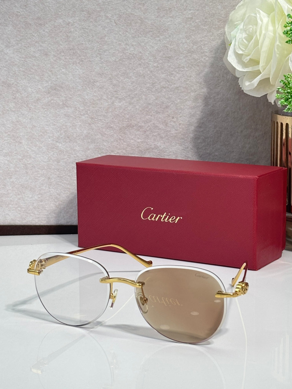 Cartier sunglasses with gold-tone frame and beige gradient lenses