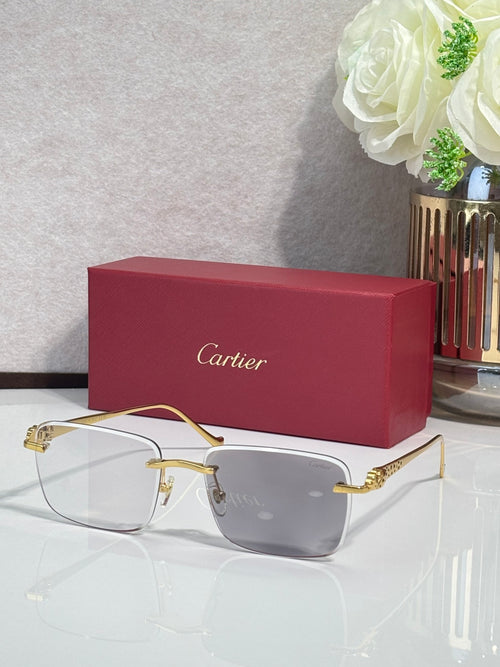 Cartier glasses with gold-tone frames and clear lenses, shown with a burgundy box