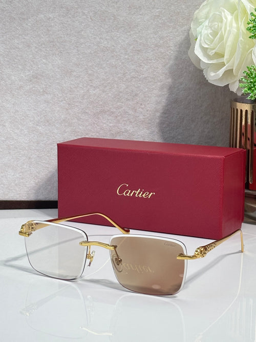 Cartier glasses with gold-tone frames and light tan-tinted lenses, with burgundy box