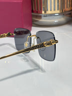 Cartier glasses side view with gold-tone hinges and dark-tinted lenses