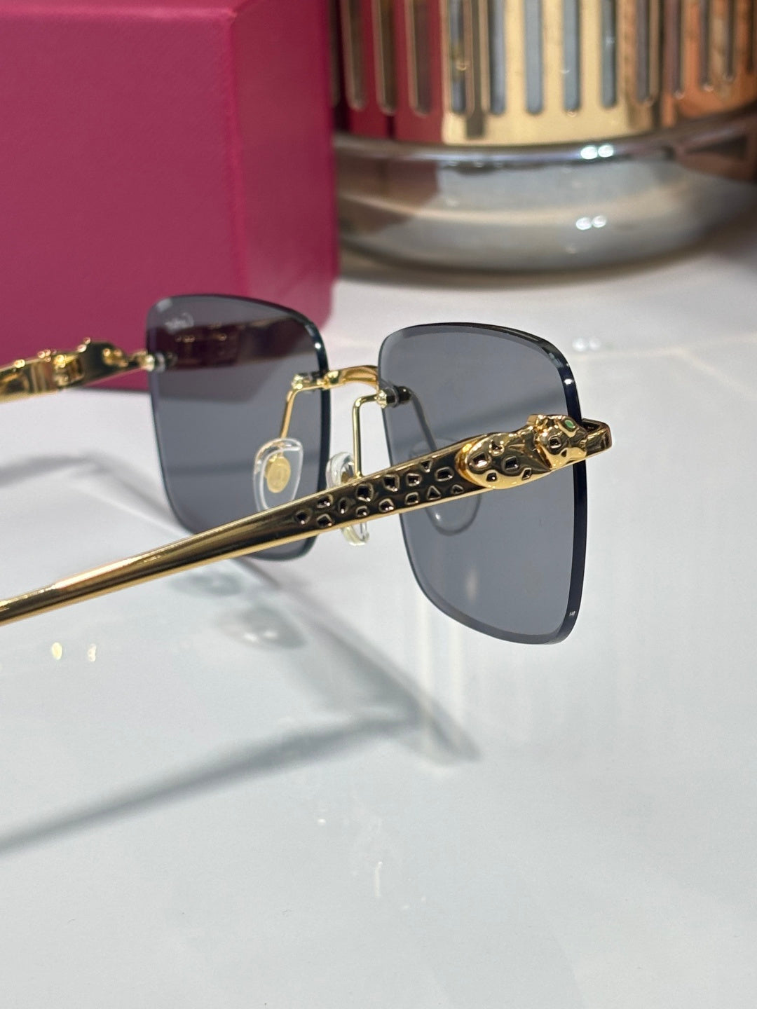 Cartier glasses side view with gold-tone hinges and dark-tinted lenses