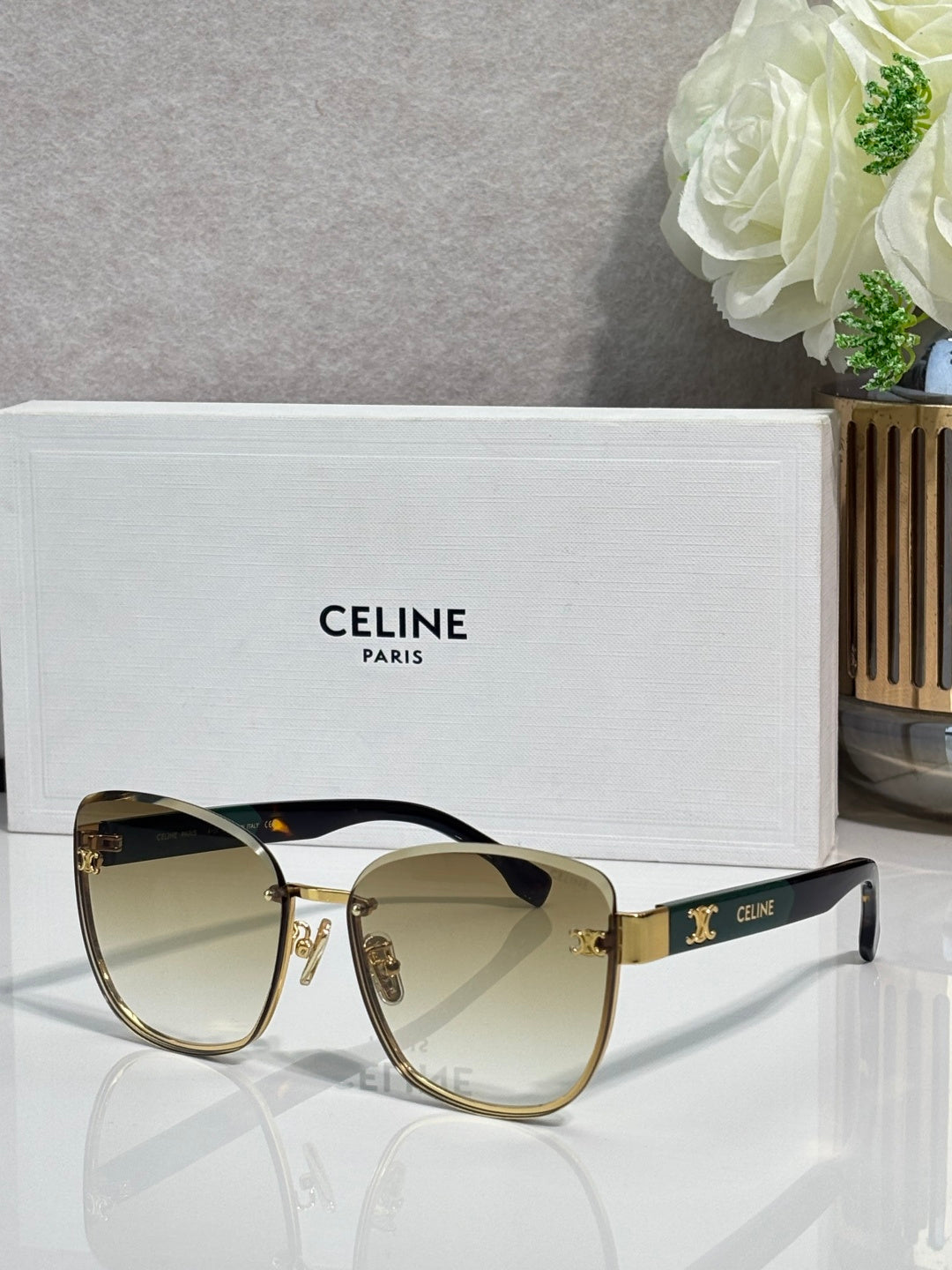 Celine sunglasses, light tortoise frame, dark lenses with gold-tone accents