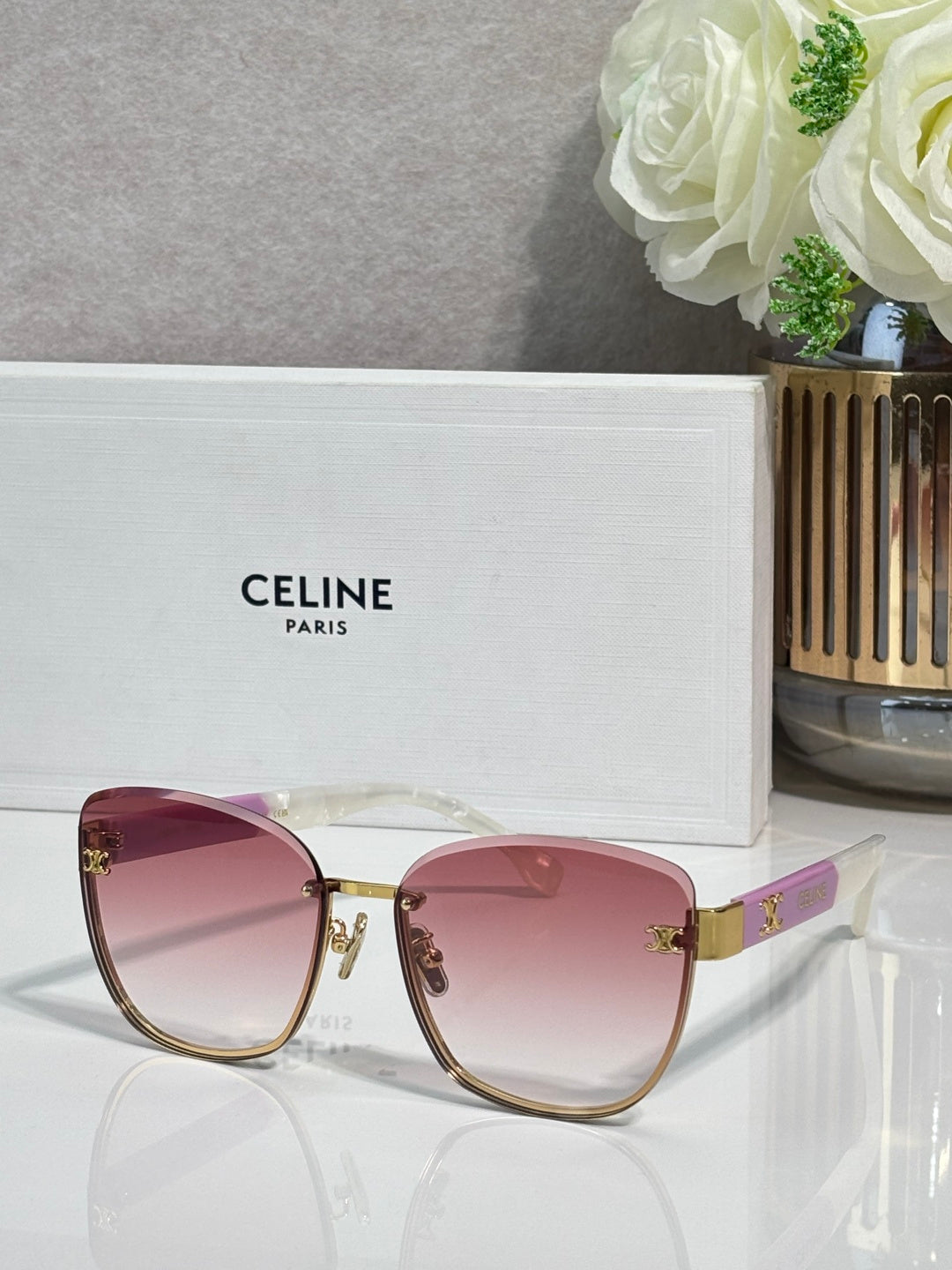 Celine sunglasses, rose-pink gradient lenses, gold-tone cat-eye frame