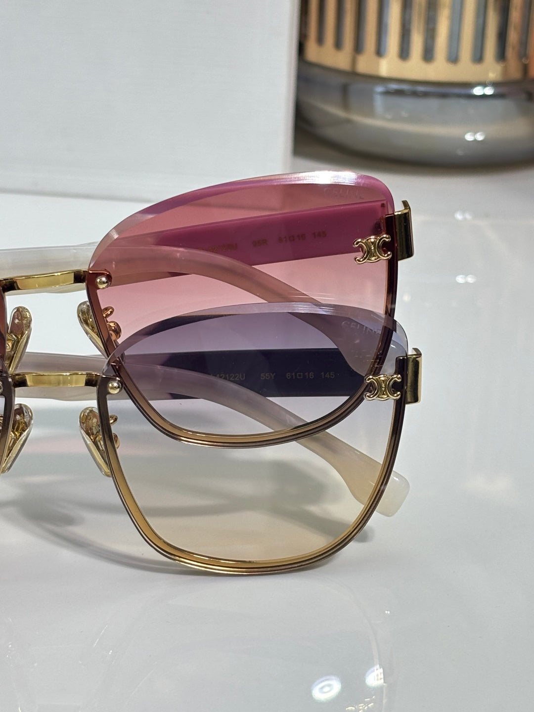 Celine sunglasses, close-up, pink gradient lenses, gold-tone and clear temples