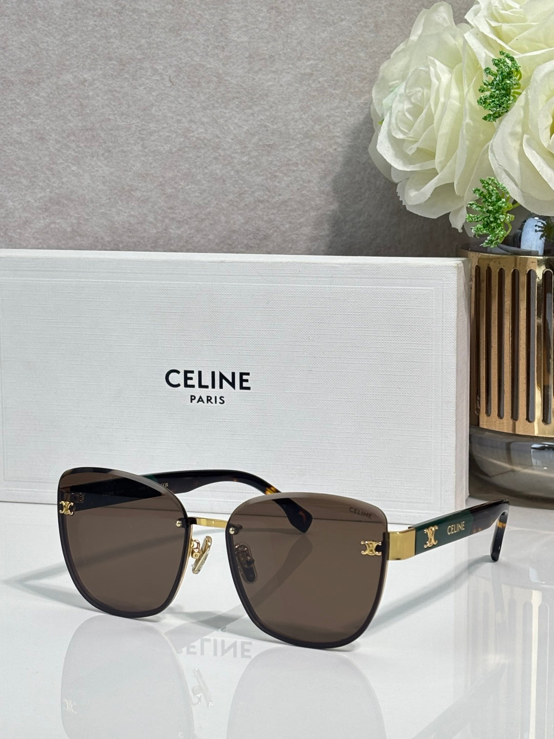 Celine sunglasses, dark brown gradient lenses, gold-tone cat-eye frame