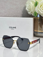 Celine sunglasses with dark-tinted lenses and gold-tone frame, rounded square