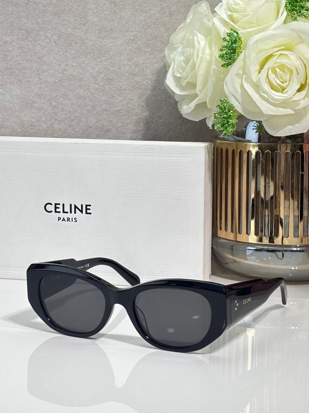 Celine black sunglasses with rounded frames and dark lenses