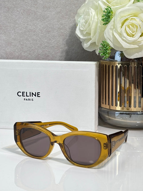 Celine yellow sunglasses with rounded frames and dark lenses