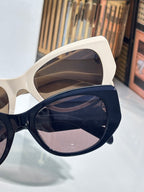 Celine sunglasses with cream and navy frames, dark lenses