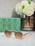 Gucci hexagon sunglasses with brown gradient lenses and gold-tone metal frame