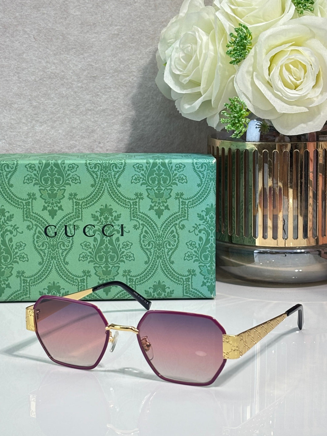 Gucci hexagon sunglasses with mauve gradient lenses and gold-tone metal frame