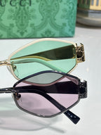 Cat-eye sunglasses pair: one mint-lens style with gold frame, one purple-lens style with black frame.