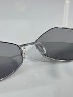 Versace sunglasses close-up of temple and gray-tinted lens