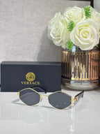 Versace octagonal sunglasses with gold-tone frames and dark-tint lenses