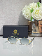 Versace octagonal sunglasses with gold-tone frames and gray-tinted lenses