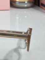 Eyeglasses temple with engraved lettering on the side arm