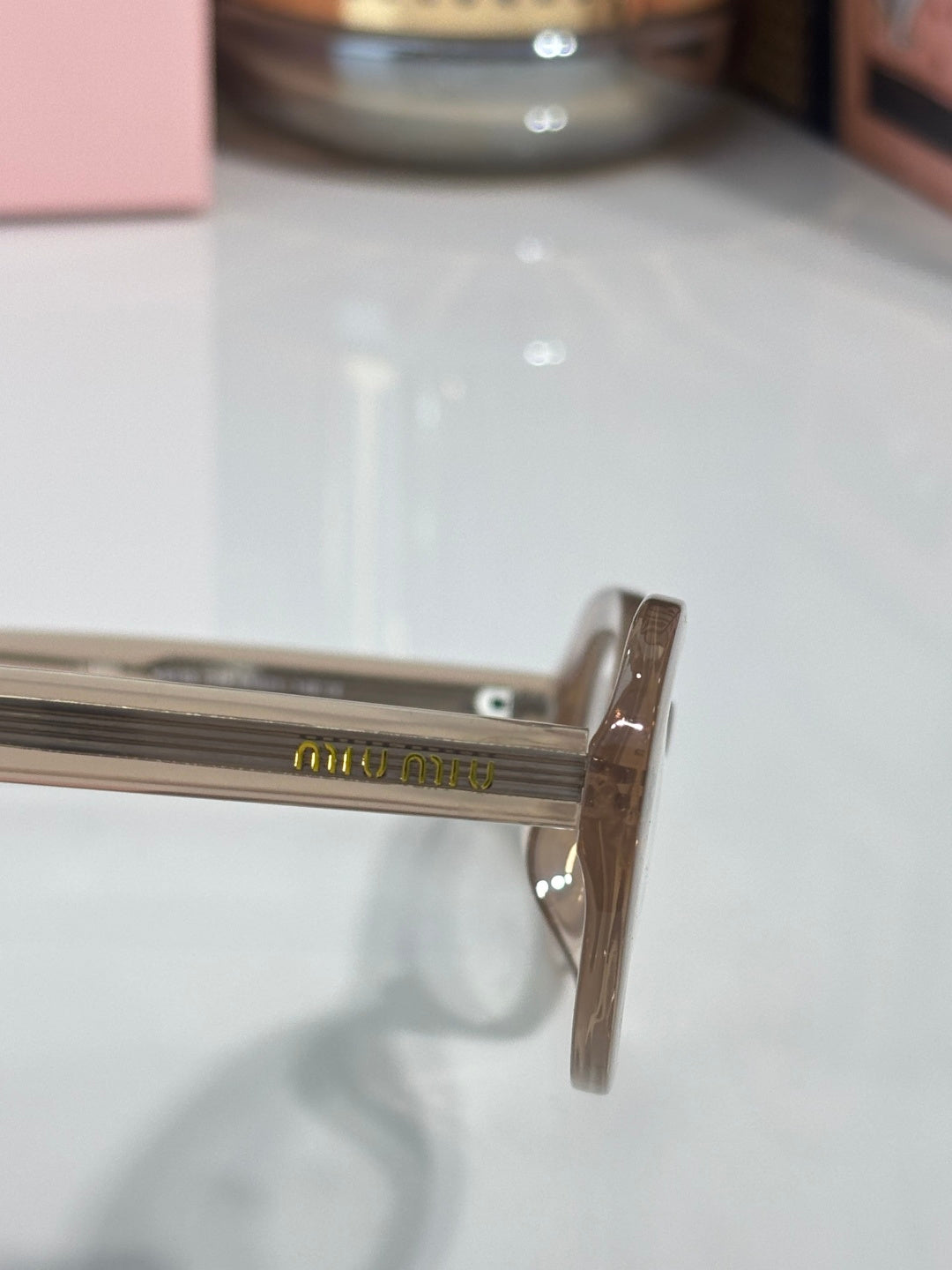 Eyeglasses temple with engraved lettering on the side arm