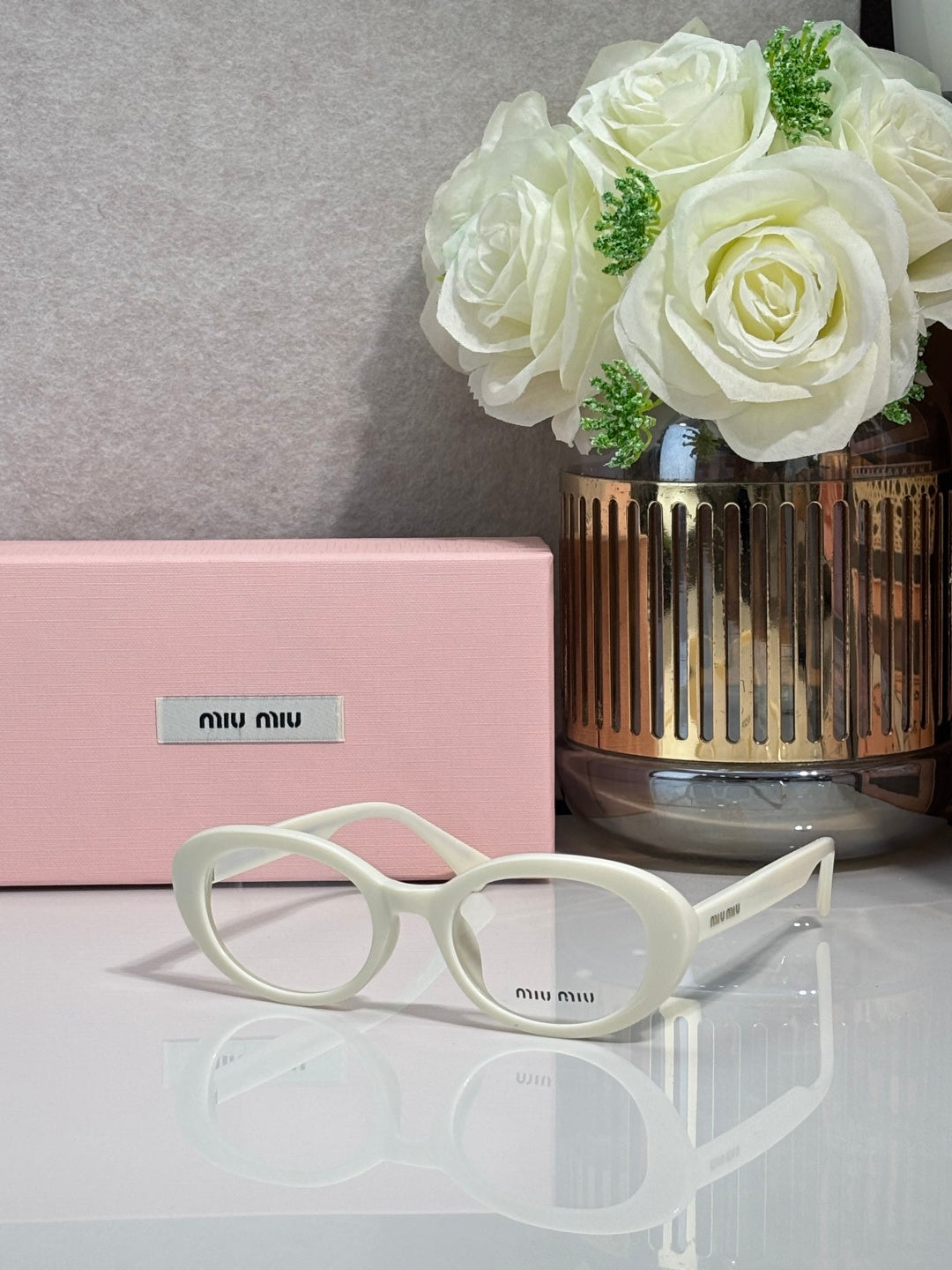 MiuMiu eyeglasses with pale mint translucent frame and round optical lenses