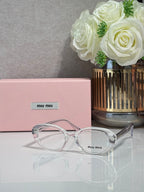 MiuMiu eyeglasses with clear translucent frame and round optical lenses