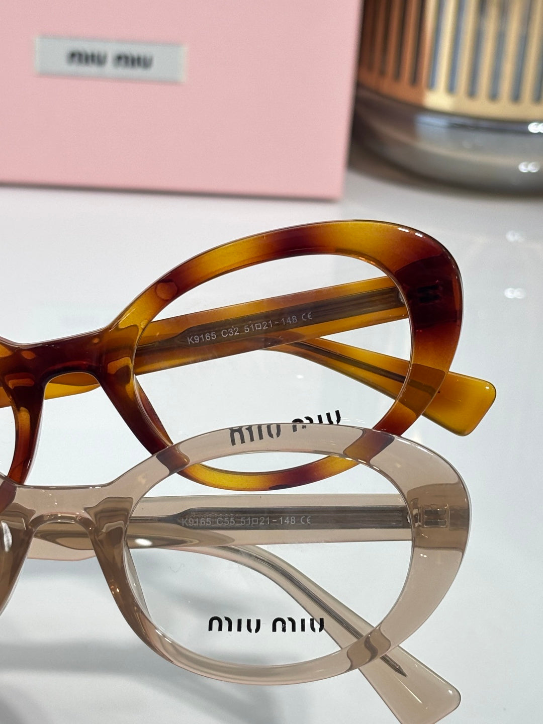 Tortoiseshell and clear eyeglasses with round optical lenses