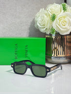 Bottega Veneta dark blue rectangular glasses with gold stud logo on the temple
