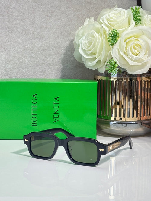 Bottega Veneta dark blue rectangular glasses with gold stud logo on the temple