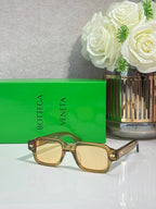 Bottega Veneta light brown rectangular glasses with gold temple detailing