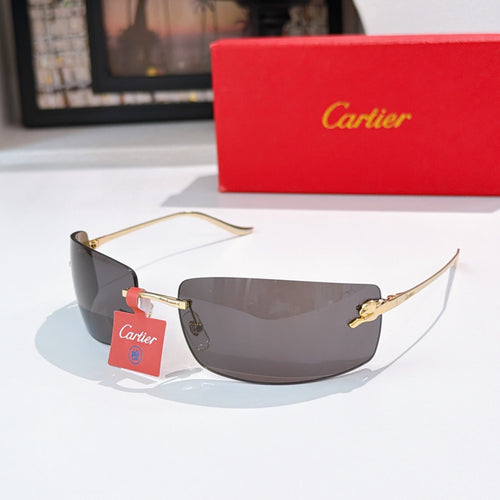 Cartier sunglasses with gold frame and dark gray tinted lenses, side view