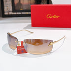 Cartier sunglasses with gold frame and clear-to-tinted lenses, label on temple