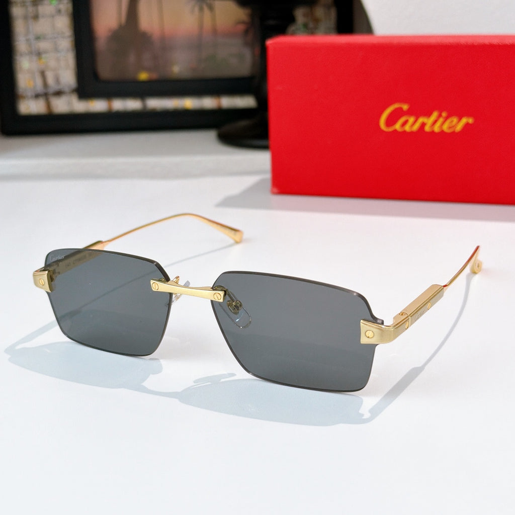 Rectangular sunglasses with green tinted lenses and gold metal frame.