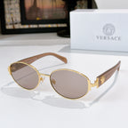 Sunglasses with gold frame and light brown lenses, with brown temple arms