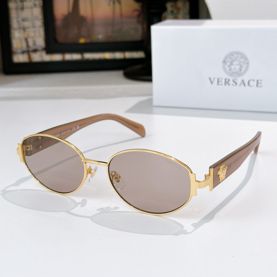 Sunglasses with gold frame and light brown lenses, with brown temple arms