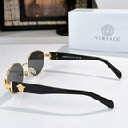Sunglasses side view with gold frame, dark lenses, and black temple arms
