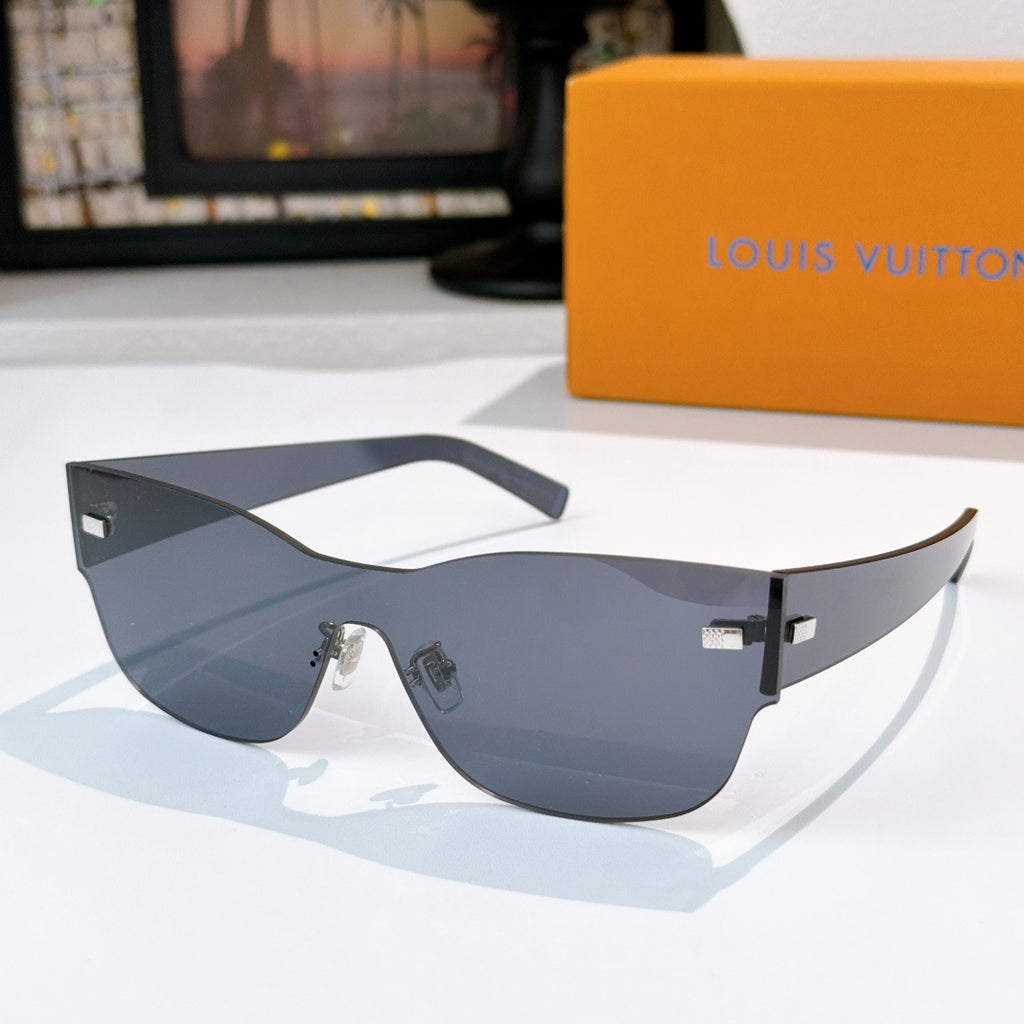 Louis Vuitton sunglasses with dark gray frames, wide lenses, and gold-tone logo detail.