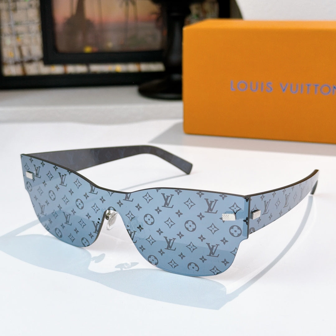 Louis Vuitton monogram sunglasses with blue patterned frames and gold-tone bridge hardware.