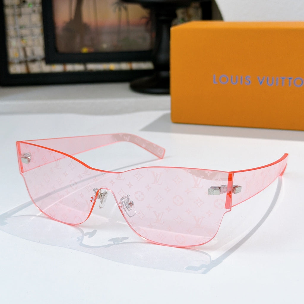 Louis Vuitton translucent pink monogram sunglasses with red-tinted lens frames and gold-tone accents.