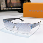 Louis Vuitton monogram sunglasses with beige patterned frames and gold-tone hardware, clear lenses.
