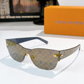 Louis Vuitton monogram sunglasses with beige-and-navy patterned frames, gold-tone hardware.