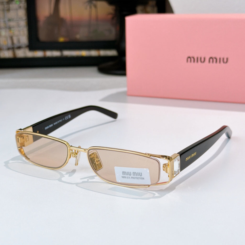 Designer eyeglasses with light nude lenses, gold frame, and black temple tips