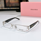 Designer eyeglasses with clear oval lenses, silver frame, and black temple tips
