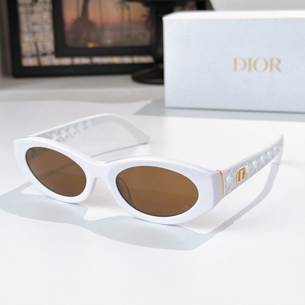 Dior cat-eye sunglasses with white frame and brown tinted lenses