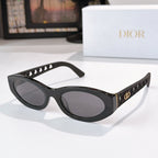 Dior cat-eye sunglasses with black frame and dark gray tinted lenses