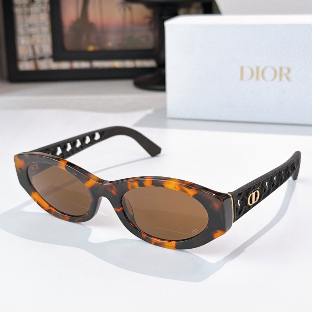 Dior cat-eye sunglasses with tortoiseshell frame and amber tinted lenses