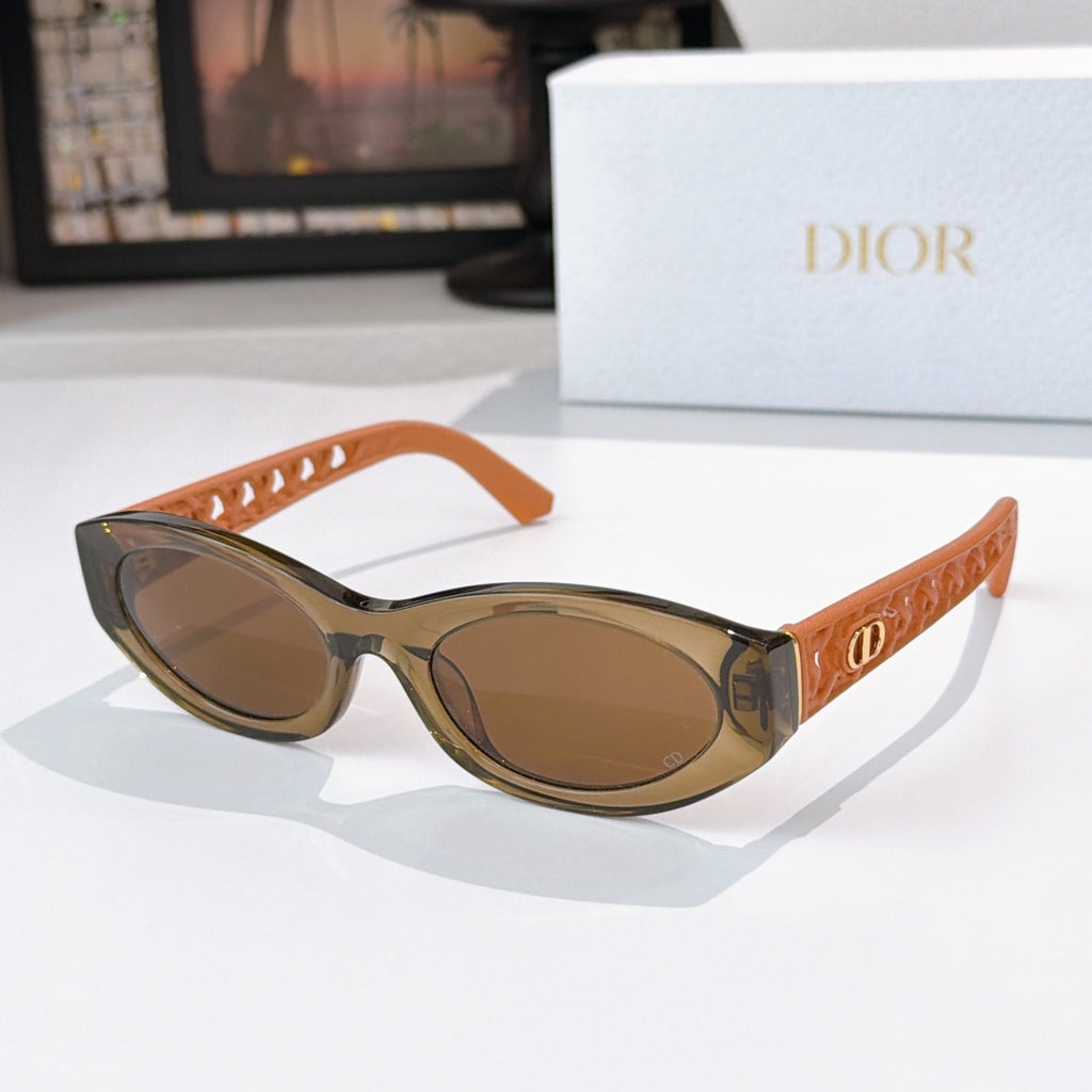 Dior cat-eye sunglasses with orange frame and brown tinted lenses
