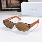 Dior cat-eye sunglasses with orange frame and brown tinted lenses