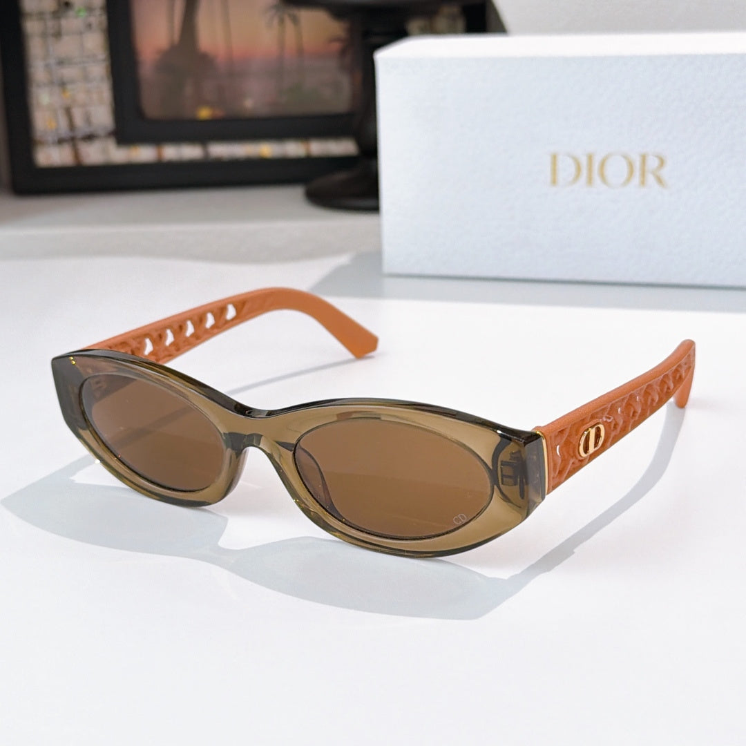 Dior cat-eye sunglasses with orange frame and brown tinted lenses