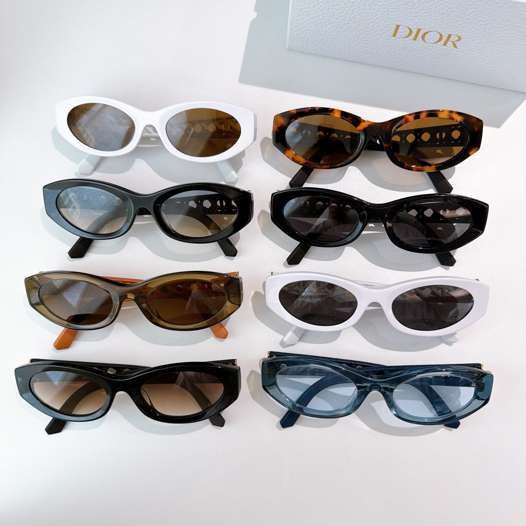 Assorted Dior cat-eye sunglasses display with mixed frame colors and tinted lenses
