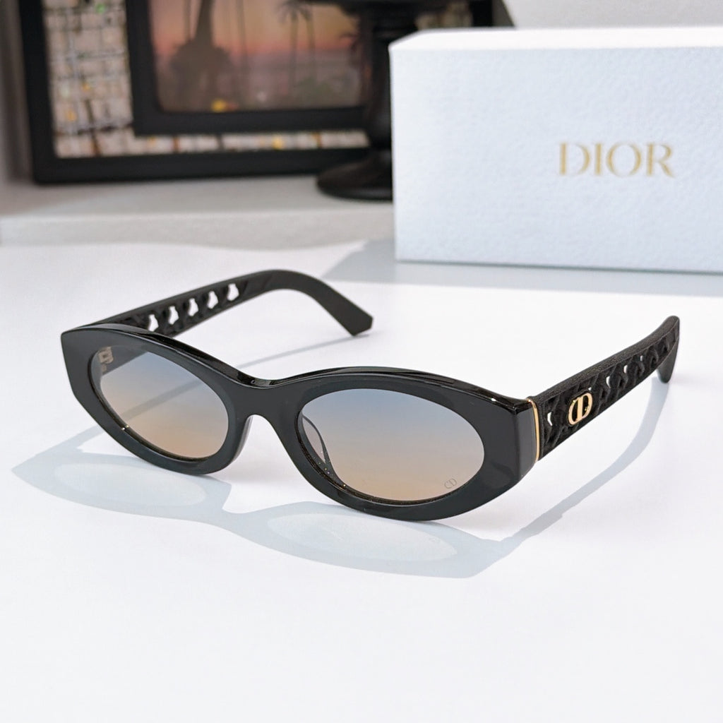 Dior cat-eye sunglasses with black frame and warm beige tinted lenses