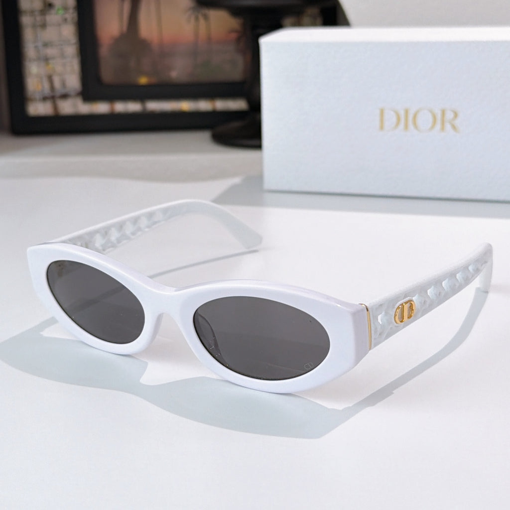 Dior cat-eye sunglasses with white frame and dark tinted lenses