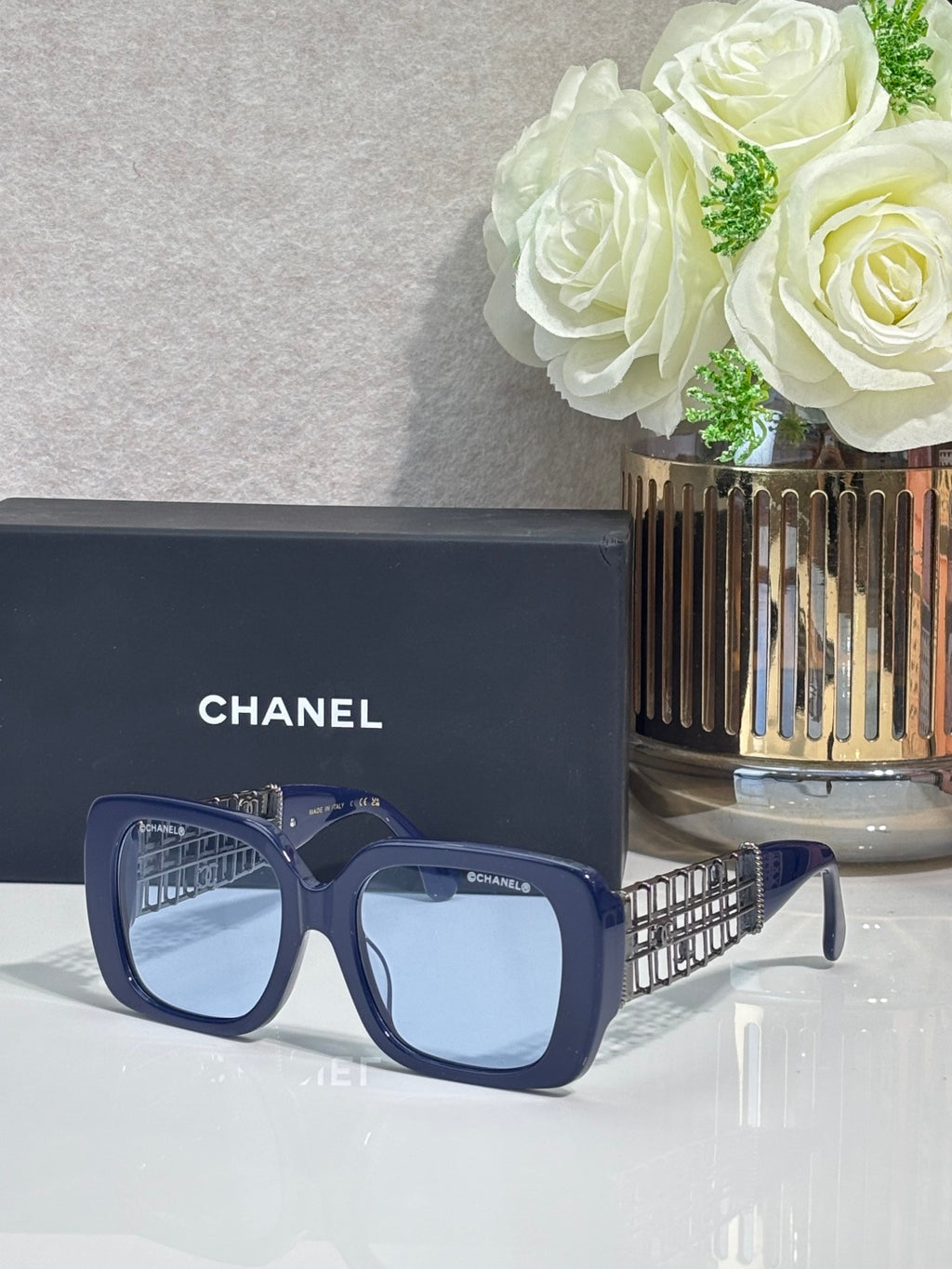 Chanel sunglasses with navy frame and light blue lenses